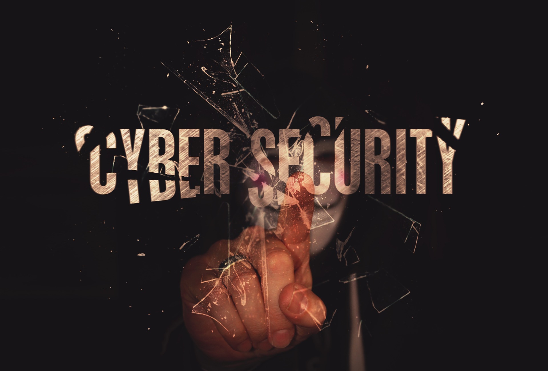 A person pointing his index finger to the text 'CYBER SECURITY'